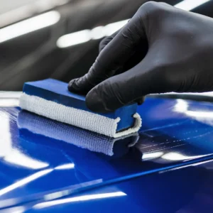 applying ceramic coating to a blue car